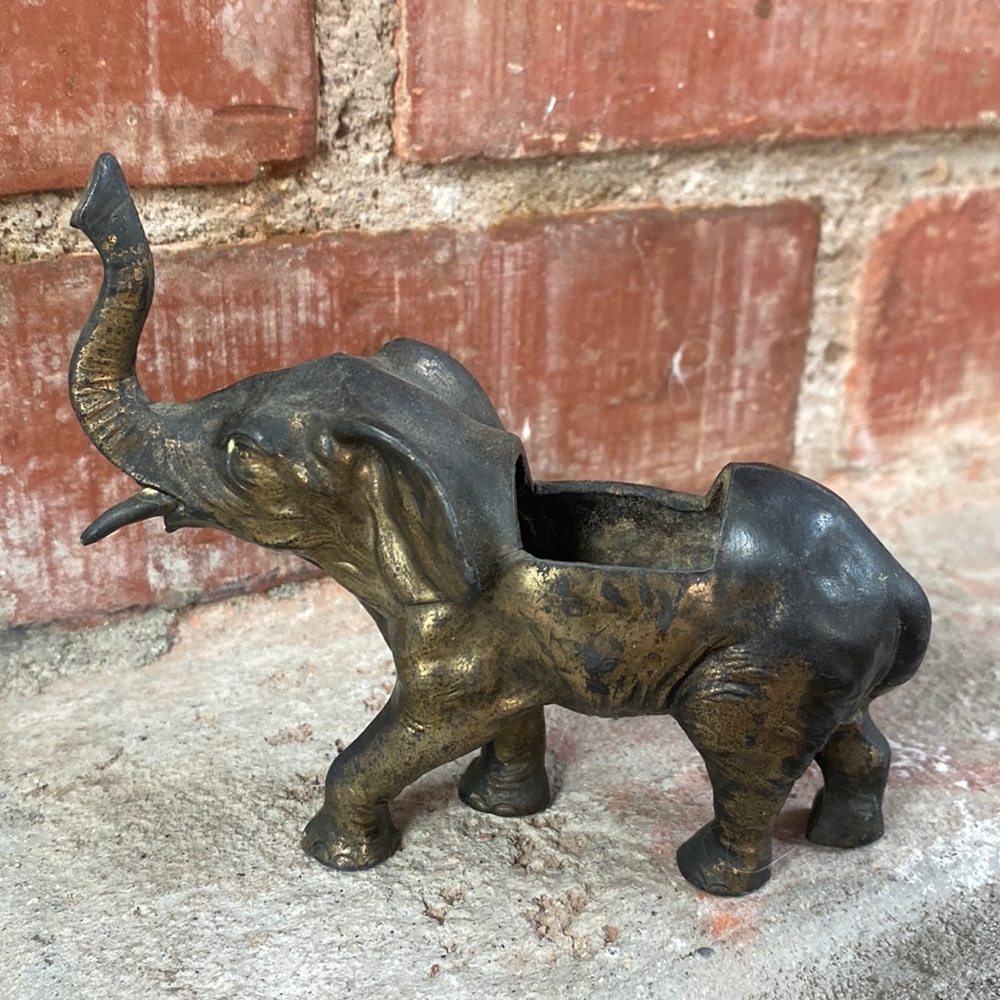 Tiny metal elephant planter